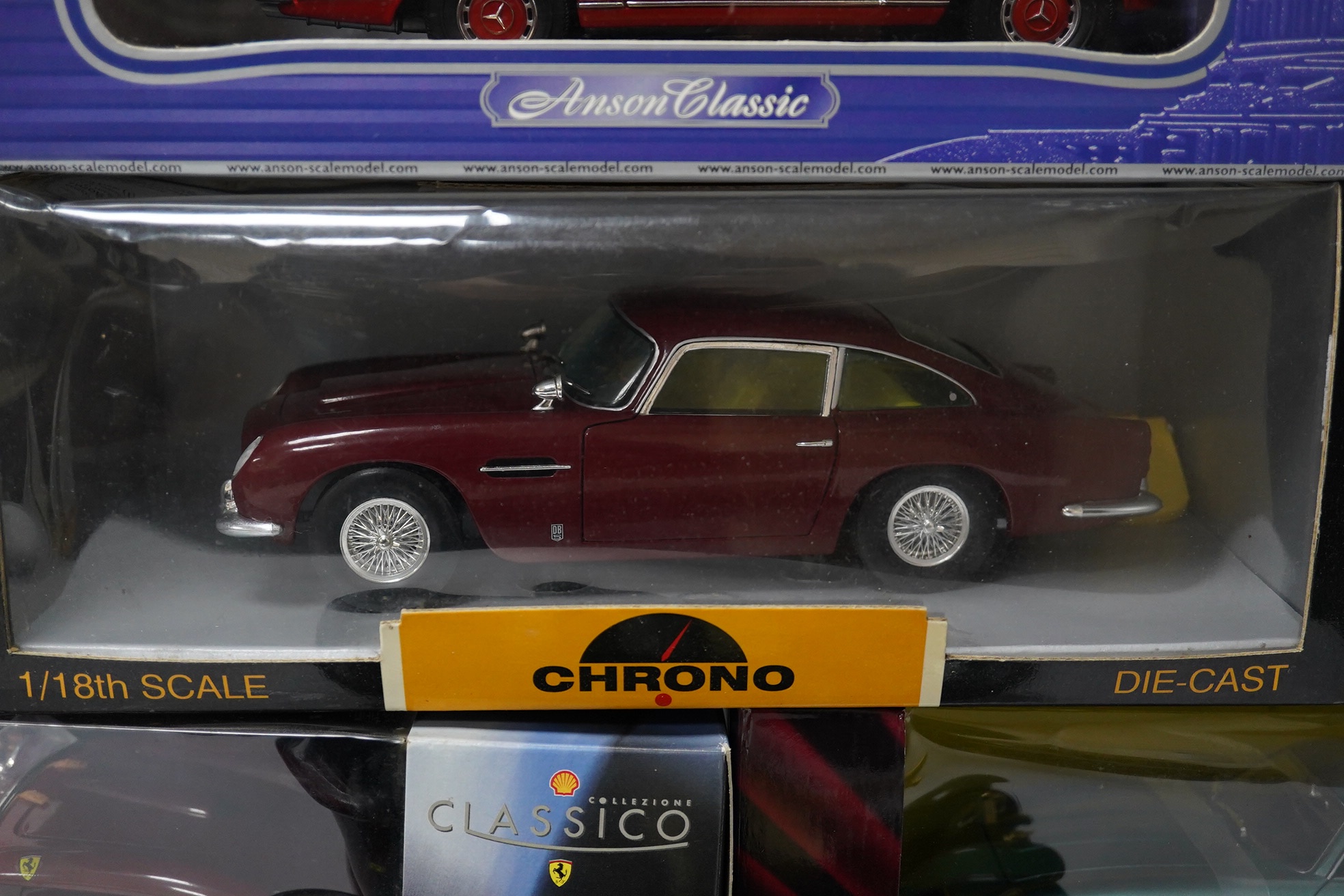 Five boxed large scale diecast cars; a 1:16 scale Franklin Mint 1905 Rolls-Royce 10hp, with one wheel detached and one side lamp detached (both present), together with four 1:18 scale cars; a Chrono Aston Martin DB5, a R